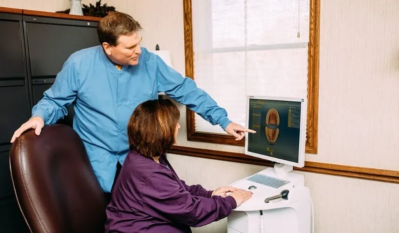 Park View Dental's Dr. Carolyn Larsen and Dr. James Larsen discussing a patient's x-rays